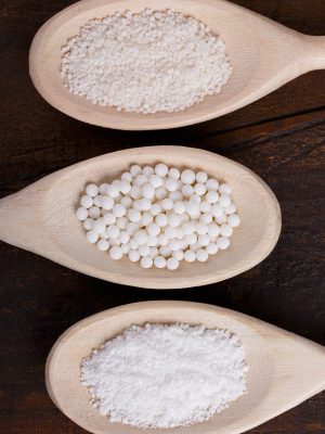 Different types of Granulated cassava (tapioca) on wooden background. Selective focus